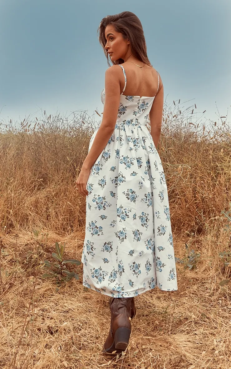 Robe mi-longue à imprimé petites fleurs bleu et corset froncé