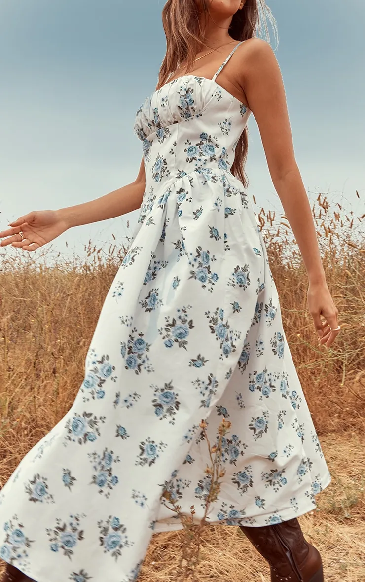 Robe mi-longue à imprimé petites fleurs bleu et corset froncé